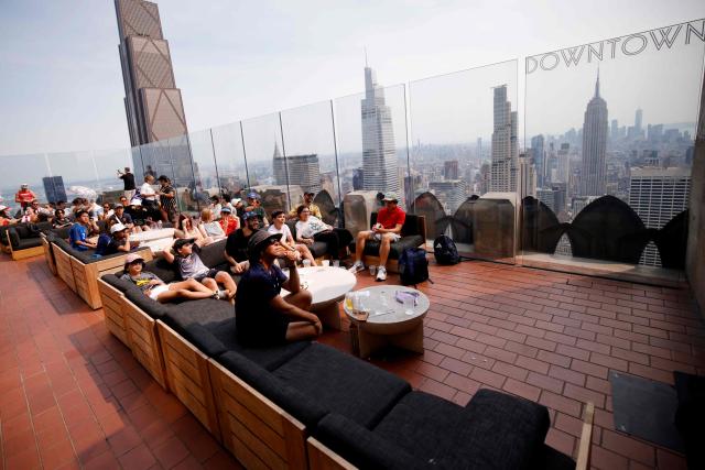 Fans attend a watch party for the World Cup semifinal football match between France and Spain at The Top of the Rock at Rockefeller Center in New York on July 14, 2026. (Photo by Leonardo Munoz / AFP)