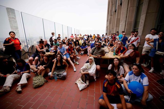 Fans attend a watch party for the World Cup semifinal football match between France and Spain at The Top of the Rock at Rockefeller Center in New York on July 14, 2026. (Photo by Leonardo Munoz / AFP)