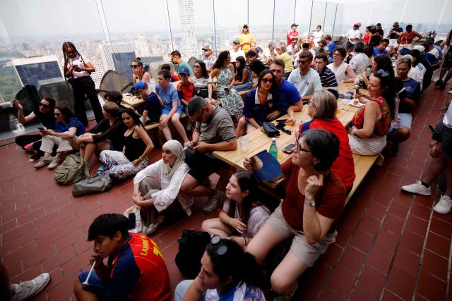 Fans attend a watch party for the World Cup semifinal football match between France and Spain at The Top of the Rock at Rockefeller Center in New York on July 14, 2026. (Photo by Leonardo Munoz / AFP)