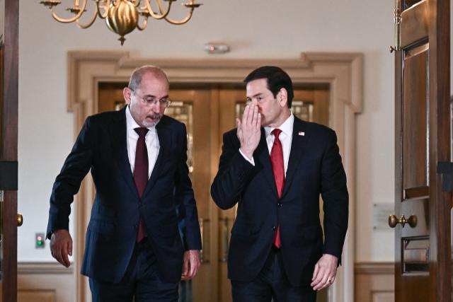 US Secretary Marco Rubio (R) walks with Jordanian Deputy Prime Minister and Foreign Minister Ayman Safadi as they meet at the State Department in Washington, DC, on July 14, 2026. (Photo by Brendan SMIALOWSKI / AFP)