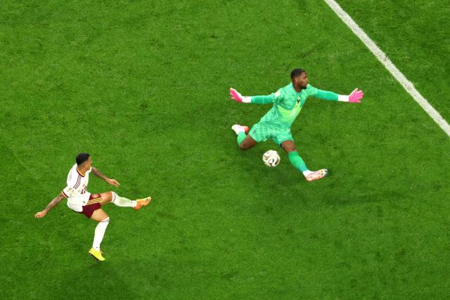 Spain's defender #12 Pedro Porro scores his team's second goal past France's goalkeeper #16 Mike Maignan during the 2026 World Cup football tournament semi-final match between France and Spain at the Dallas Stadium in Arlington on July 14, 2026.  (Photo by Odd ANDERSEN / AFP)