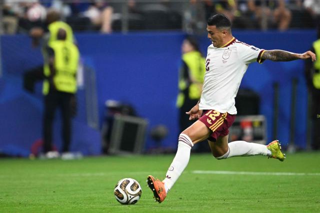 Spain's defender #12 Pedro Porro shoots to score his team's second goal during the 2026 World Cup football tournament semi-final match between France and Spain at the Dallas Stadium in Arlington on July 14, 2026.  (Photo by MAURO PIMENTEL / AFP)