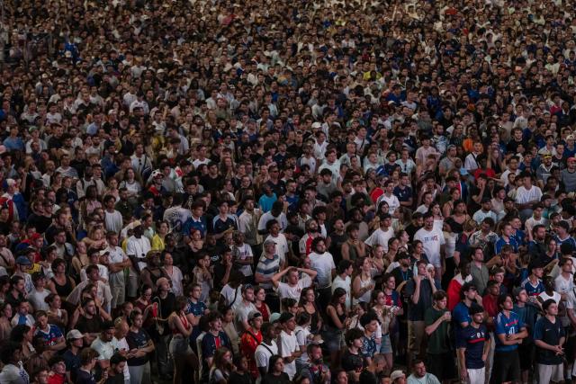 Supporters of France's football team watch the 2026 World Cup semi final football match between France and Spain on a giant screen at the Toulouse Stadium, in Toulouse on July 14, 2026. (Photo by Ed JONES / AFP)