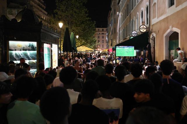 Supporters of France's football team watch the 2026 World Cup semi final football match between France and Spain in a street of Marseille on July 14, 2026. (Photo by Thibaud MORITZ / AFP)