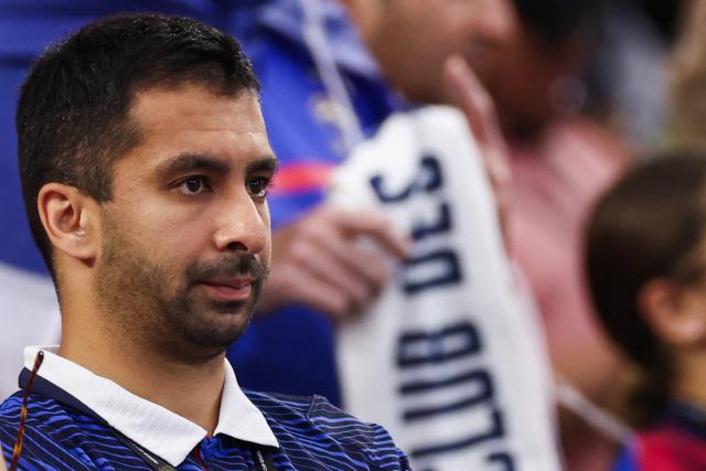 A French fan reacts after losing the 2026 World Cup football tournament semi-final match between France and Spain at the Dallas Stadium in Arlington on July 14, 2026.  (Photo by FRANCK FIFE / AFP)