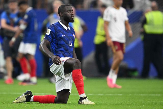 France's defender #04 Dayot Upamecano reacts after losing the 2026 World Cup football tournament semi-final match between France and Spain at the Dallas Stadium in Arlington on July 14, 2026.  (Photo by MAURO PIMENTEL / AFP)