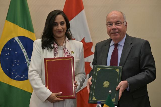 Canada's Foreign Minister Anita Anand shakes hands with her Brazilian counterpart Mauro Vieira exchange documents during the fifth bilateral Strategic Partnership Dialogue at Sao Paulo's State Industry Federation (FIESP) headquarters in Sao Paulo Brazil on July 14, 2026. (Photo by NELSON ALMEIDA / AFP)