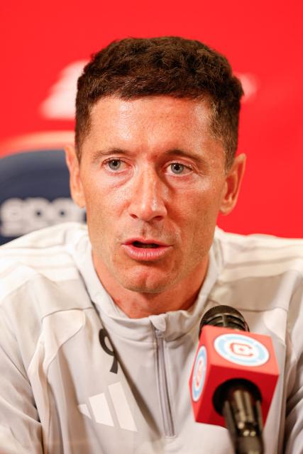 Polish forward #09 Robert Lewandowski speaks during a press conference as he is officially introduced as a new member of the Chicago Fire FC at Endeavor Health Performance Center ahead of his MLS debut in Chicago, Illinois, on July 14 2026. Poland's all-time leading goal scorer Robert Lewandowski has signed a contract through the 2027-28 campaign with the Chicago Fire, the Major League Soccer club announced in late June 2026. The 37-year-old striker arrives from Barcelona after helping the Spanish giants capture the La Liga crown last month having starred from 2014-2022 with Bayern Munich. (Photo by KAMIL KRZACZYNSKI / AFP)