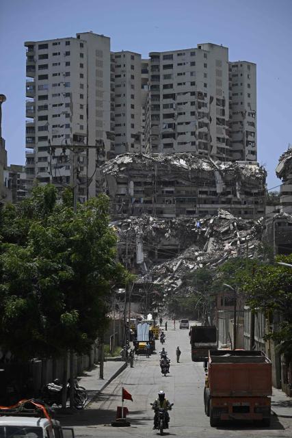 View of damages in Catia La Mar, La Guaira state, Venezuela, on July 14, 2026, following twin earthquakes that struck the region. The death toll from the deadly earthquakes that hit Venezuela on June 14 has surpassed 4,700, while almost 17,000 people have been injured, an official report released on July 14 stated. (Photo by Federico PARRA / AFP)