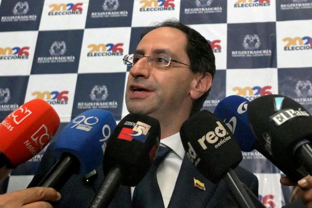 (FILES) Jose Manuel Restrepo, running mate of Colombia's presidential candidate Abelardo de la Espriella (R), speaks to reporters during the presentation of their ticket at the Cali registration office in Cali, Colombia, on March 12, 2026. Colombia’s vice president-elect, Jose Manuel Restrepo, on July 14, 2026 offered the incoming government’s cooperation to the United States to help facilitate a political transition in Venezuela, during a working visit to Washington. (Photo by Joaquin SARMIENTO / AFP)