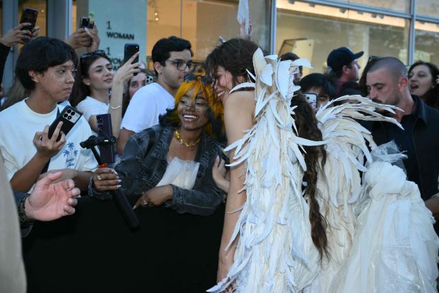 US actress Zendaya takes selfies with fans as she attends "The Odyssey" premiere at the AMC Lincoln Square in New York on July 14, 2026. (Photo by ANGELA WEISS / AFP)