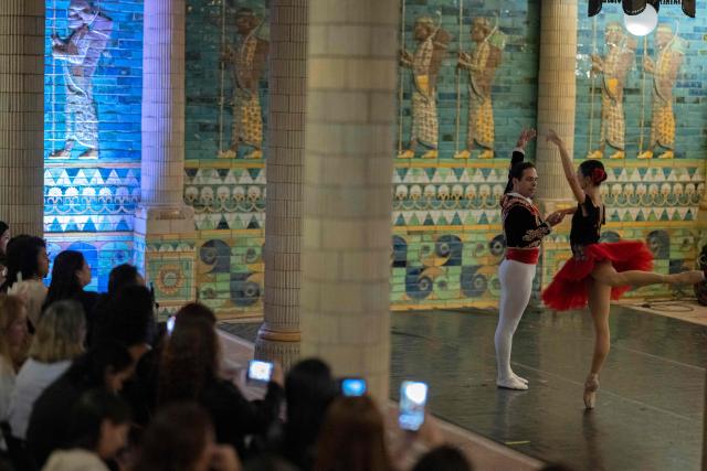 Principal dancers of the Theatro Municipal do Rio de Janeiro, Marcia Jaqueline (R) and Cicero Gomes, perform an excerpt from Don Quixote during celebrations marking the theatre's 117th anniversary with a series of events open to the public,on July 14, 2026, in Rio de Janeiro, Brazil. (Photo by Pablo PORCIUNCULA / AFP)