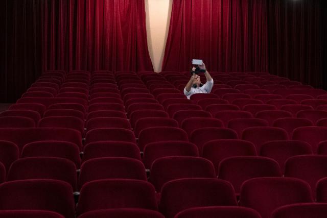 A visitor takes part in a guided tour the Theatro Municipal do Rio de Janeiro (Rio de Janeiro's Municipal Theater) during celebrations marking its 117th anniversary with a series of events open to the public, on July 14, 2026, in Rio de Janeiro, Brazil. (Photo by Pablo PORCIUNCULA / AFP)