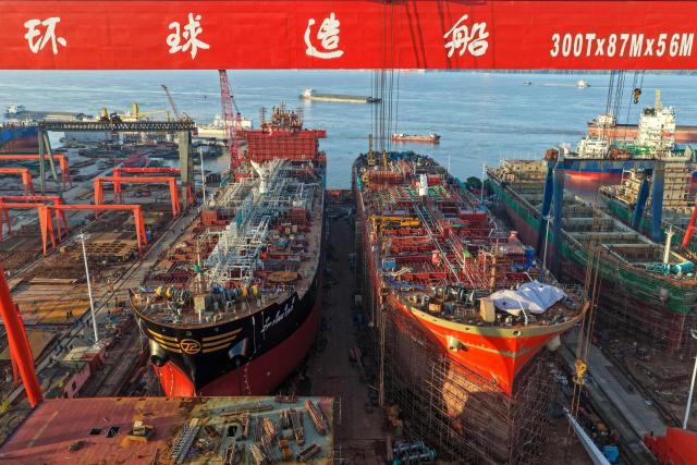 Ships are seen under construction at a shipyard on the Yangtze river in Yangzhou, in China’s eastern Jiangsu province, on July 15, 2026. (Photo by CN-STR / AFP) / China OUT