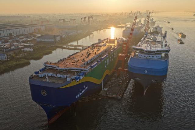 Ships are seen at a shipyard on the Yangtze river in Yangzhou, in China’s eastern Jiangsu province, on July 15, 2026. (Photo by CN-STR / AFP) / China OUT