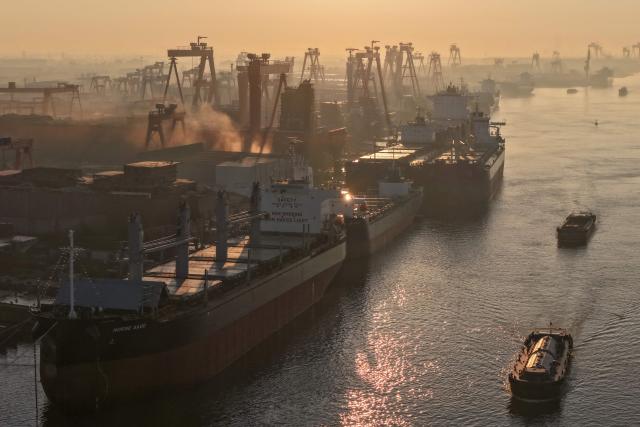 Ships are seen at a shipyard on the Yangtze river in Yangzhou, in China’s eastern Jiangsu province, on July 15, 2026. (Photo by CN-STR / AFP) / China OUT