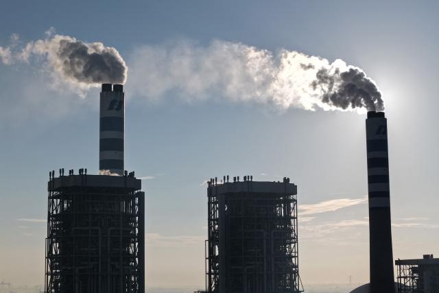 A coal-fired power plant is seen in Zhenjiang, in China’s eastern Jiangsu province on July 15, 2026. (Photo by CN-STR / AFP) / China OUT