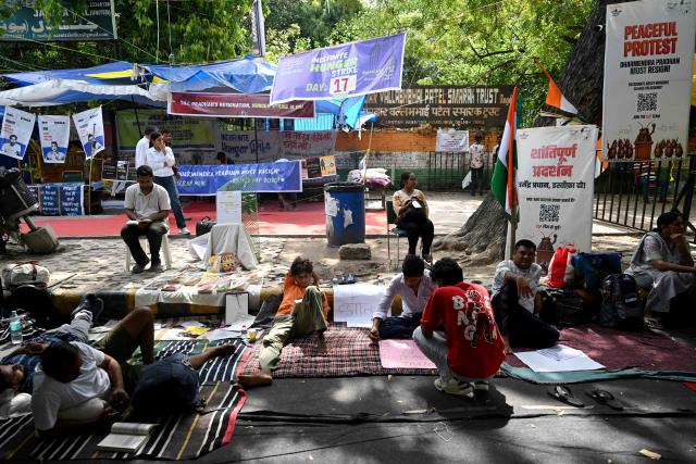 Cockroach Janta Party (CJP) supporters take part in a hunger strike during a sit-in protest in New Delhi on July 15, 2026, to demand the resignation of India’s Education Minister Dharmendra Pradhan over alleged examination irregularities. (Photo by Arun SANKAR / AFP)