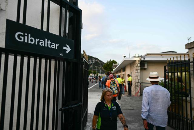 People walk from La Linea de la Concepcion, Spain into the British territory of Gibraltar for the first time without border controls on July 15, 2026. A new era began between Spain and the tiny British territory of Gibraltar on Wednesday, as border checks that have long been a source of tension and frustration were finally lifted. (Photo by JORGE GUERRERO / AFP)
