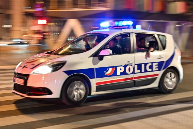 French police officers drive a car after the 2026 World Cup semi final football match between France and Spain at Place de la Bastille in Paris on July 14, 2026. (Photo by Martin LELIEVRE / AFP)