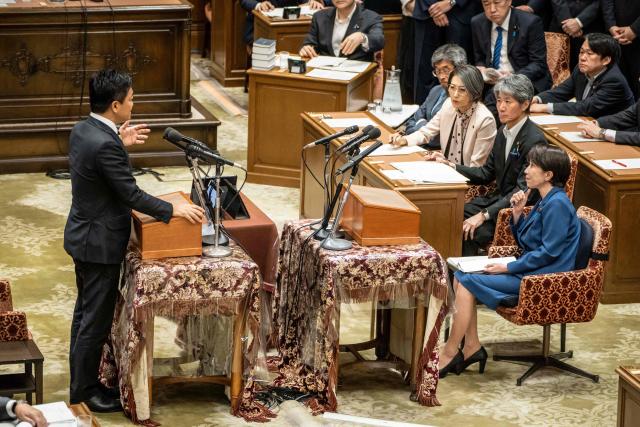 Japan's Prime Minister Sanae Takaichi (bottom R) attends the joint meeting of the committees of both houses on fundamental national policies at the National Diet in Tokyo on July 15, 2026. (Photo by Yuichi YAMAZAKI / AFP)