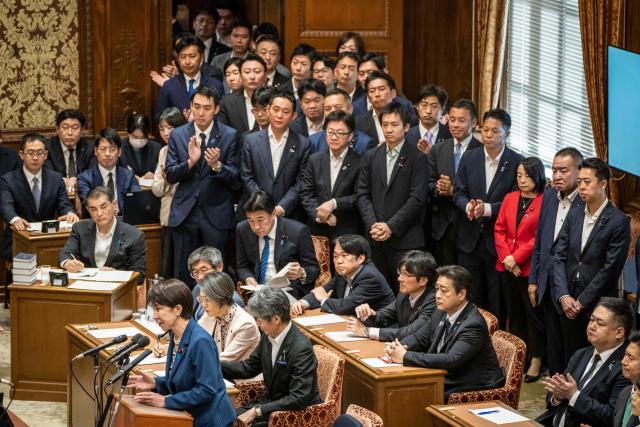 Japan's Prime Minister Sanae Takaichi (bottom L) answers a question during the joint meeting of the committees of both houses on fundamental national policies at the National Diet in Tokyo on July 15, 2026. (Photo by Yuichi YAMAZAKI / AFP)