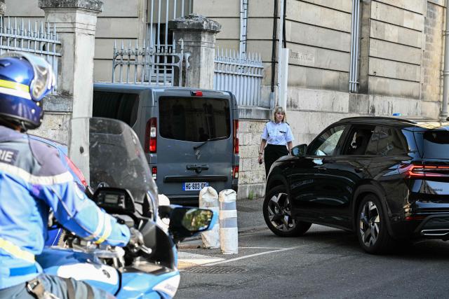 This photograph shows a police motorcade arriving to the courthouse before a hearing of   Jerome Barella, suspected of the killing of 11-year-old Lyhanna, in Agen on July 15, 2026. The death and rape of Lyhanna, an 11-year-old middle school student who went missing in late May before being found dead on June 4 in the Gers, has stirred a wave of anger and emotion across the country, with an inspection mission concluding there were failures in the justice system. Barella, a 41-year-old father of a school friend of the victim, had twice before been formally accused of raping a child, but investigations had been dropped or had stalled. (Photo by Lionel BONAVENTURE / AFP)