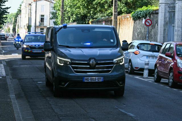 This photograph shows a police motorcade arriving to the courthouse before a hearing of   Jerome Barella, suspected of the killing of 11-year-old Lyhanna, in Agen on July 15, 2026. The death and rape of Lyhanna, an 11-year-old middle school student who went missing in late May before being found dead on June 4 in the Gers, has stirred a wave of anger and emotion across the country, with an inspection mission concluding there were failures in the justice system. Barella, a 41-year-old father of a school friend of the victim, had twice before been formally accused of raping a child, but investigations had been dropped or had stalled. (Photo by Lionel BONAVENTURE / AFP)