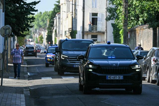 This photograph shows a police motorcade arriving to the courthouse before a hearing of   Jerome Barella, suspected of the killing of 11-year-old Lyhanna, in Agen on July 15, 2026. The death and rape of Lyhanna, an 11-year-old middle school student who went missing in late May before being found dead on June 4 in the Gers, has stirred a wave of anger and emotion across the country, with an inspection mission concluding there were failures in the justice system. Barella, a 41-year-old father of a school friend of the victim, had twice before been formally accused of raping a child, but investigations had been dropped or had stalled. (Photo by Lionel BONAVENTURE / AFP)