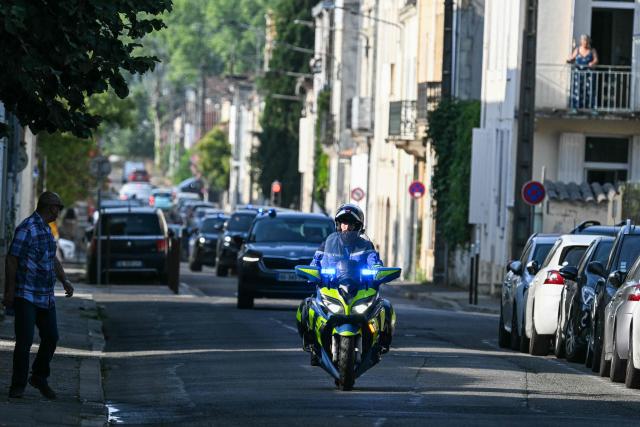 This photograph shows a police motorcade arriving to the courthouse before a hearing of   Jerome Barella, suspected of the killing of 11-year-old Lyhanna, in Agen on July 15, 2026. The death and rape of Lyhanna, an 11-year-old middle school student who went missing in late May before being found dead on June 4 in the Gers, has stirred a wave of anger and emotion across the country, with an inspection mission concluding there were failures in the justice system. Barella, a 41-year-old father of a school friend of the victim, had twice before been formally accused of raping a child, but investigations had been dropped or had stalled. (Photo by Lionel BONAVENTURE / AFP)