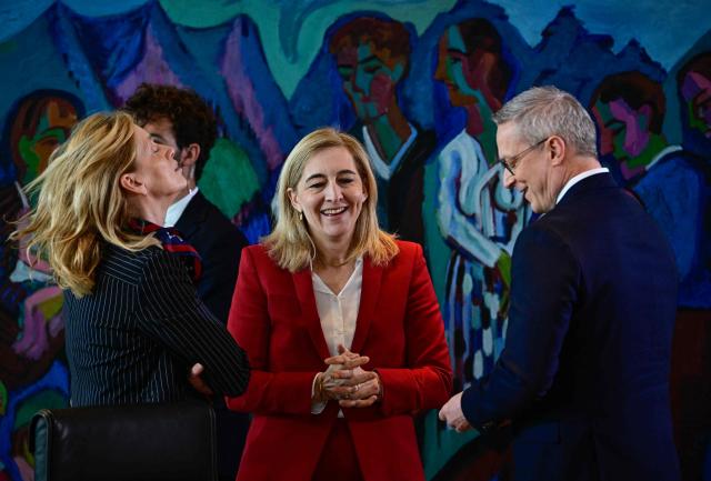 (From L) German Minister for Education, Family, Senior Citizens, Women and Youth Karin Prien, German Health Minister Nina Warken and German Minister for Digitalization and State Modernization Karsten Wildberger talk prior the start of a weekly meeting of the German cabinet themed on easing the bureaucratic burden in the country at the Chancellery in Berlin, on July 15, 2026. (Photo by Tobias SCHWARZ / AFP)