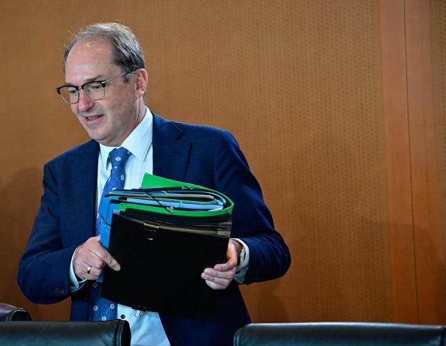 German Interior Minister Alexander Dobrindt arrives for the start of a weekly meeting of the German cabinet themed on easing the bureaucratic burden in the country at the Chancellery in Berlin, on July 15, 2026. (Photo by Tobias SCHWARZ / AFP)