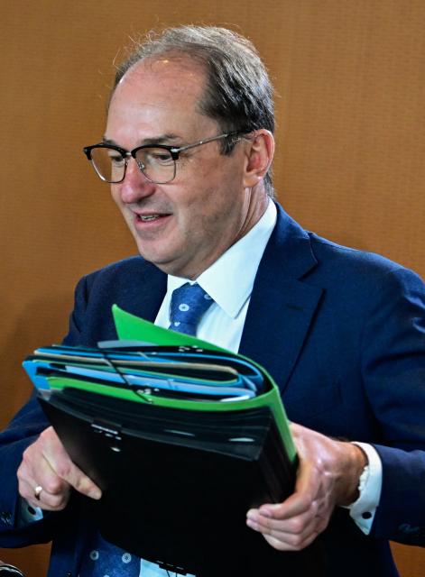 German Interior Minister Alexander Dobrindt arrives for the start of a weekly meeting of the German cabinet themed on easing the bureaucratic burden in the country at the Chancellery in Berlin, on July 15, 2026. (Photo by Tobias SCHWARZ / AFP)