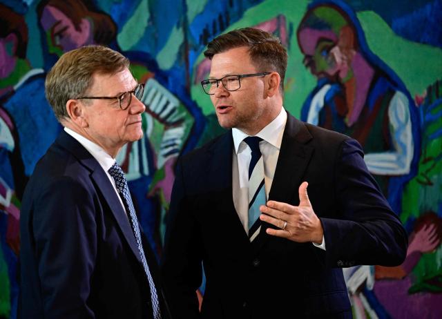 Germany's Foreign Minister Johann Wadephul and German Minister for the Environment, Climate Protection, Nature Conservation and Nuclear Safety Carsten Schneider talk prior the start of a weekly meeting of the German cabinet themed on easing the bureaucratic burden in the country at the Chancellery in Berlin, on July 15, 2026. (Photo by Tobias SCHWARZ / AFP)