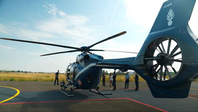 This frame grab from an AFP TV video shows the new helicopter H145 D3 of the French gendarmerie preparing to leave the 107th Air Base in Velizy-Villacoublay to take part in the annual Bastille Day military parade in Paris, on July 14, 2026. The H145 D3, has been in service for the past five months and its performance is enhanced by innovative technological features such as optronics sensors, reinforced ballistic protection and a secure data transmission system. Two helicopters of this type were funded by the British via the Sandhurst Fund, as part of the Sandhurst Cooperation Treaty between France and the United Kingdom, aimed at curbing illegal crossings of the English Channel. This treaty was signed on January 18, 2018 during the 35th Franco-British summit. A second helicopter has been delivered to Amiens. Four more are due to be delivered by 2028. (Photo by Benoît DUCROCQ / AFP)