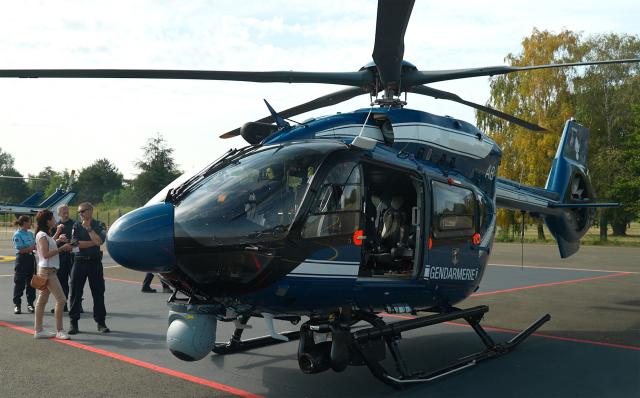 This frame grab from an AFP TV video shows the new helicopter H145 D3 of the French gendarmerie preparing to leave the 107th Air Base in Velizy-Villacoublay to take part in the annual Bastille Day military parade in Paris, on July 14, 2026. The H145 D3, has been in service for the past five months and its performance is enhanced by innovative technological features such as optronics sensors, reinforced ballistic protection and a secure data transmission system. Two helicopters of this type were funded by the British via the Sandhurst Fund, as part of the Sandhurst Cooperation Treaty between France and the United Kingdom, aimed at curbing illegal crossings of the English Channel. This treaty was signed on January 18, 2018 during the 35th Franco-British summit. A second helicopter has been delivered to Amiens. Four more are due to be delivered by 2028. (Photo by Benoît DUCROCQ / AFP)