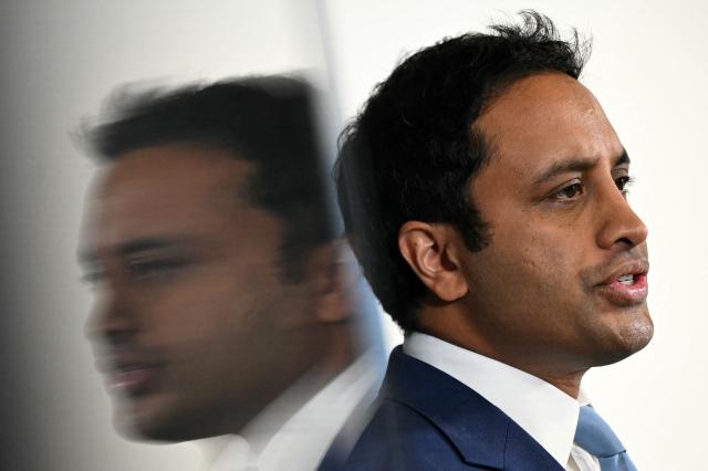 Reform UK's Head of Policy Zia Yusuf is reflected as he speaks during a party press conference in central London on July 15, 2026. (Photo by JUSTIN TALLIS / AFP)