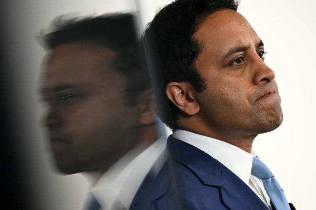 Reform UK's Head of Policy Zia Yusuf is reflected as he speaks during a party press conference in central London on July 15, 2026. (Photo by JUSTIN TALLIS / AFP)