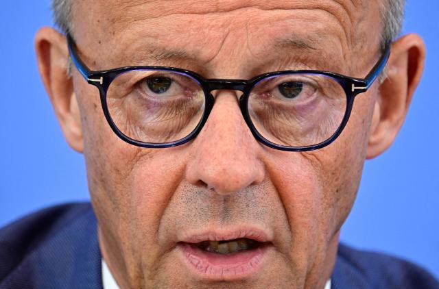 German Chancellor Friedrich Merz addresses journalists during his summer press conference in Berlin, Germany, on July 15, 2026. (Photo by Tobias SCHWARZ / AFP)