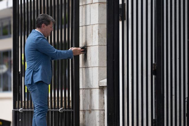 Chief Minister of Gibraltar Fabian Picardo dismantles part of the border fence during a ceremony ending border controls between Spain and the British overseas territory of Gibraltar at the  border crossing in La Linea de la Concepcion, southern Spain, on July 15, 2026. A new era began between Spain and the tiny British territory of Gibraltar on July 15, 2026, as border checks that have long been a source of tension and frustration were finally lifted after the signing of a post-Brexit deal in Brussels between the UK, Spain, Gibraltar and the EU. (Photo by JORGE GUERRERO / AFP)