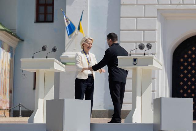 European Commission President Ursula von der Leyen (L) receives the award 'The Order of Europe' from Ukraine's President Volodymyr Zelensky during a ceremony to mark the Day of Ukrainian Statehood in Kyiv on July 15, 2026, amid the Russian invasion of Ukraine. (Photo by Tetiana DZHAFAROVA / AFP)