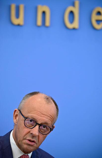 German Chancellor Friedrich Merz addresses journalists during his summer press conference in Berlin, Germany, on July 15, 2026. (Photo by Tobias SCHWARZ / AFP)