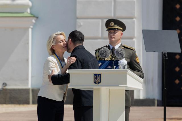 European Commission President Ursula von der Leyen (L) receives the award 'The Order of Europe' from Ukraine's President Volodymyr Zelensky during a ceremony to mark the Day of Ukrainian Statehood in Kyiv on July 15, 2026, amid the Russian invasion of Ukraine. (Photo by Tetiana DZHAFAROVA / AFP)