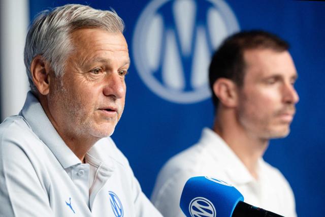 Marseille's new French head coach Bruno Genesio (L), flanked by Marseille's new French football director Gregory Lorenzi (R), speaks during a press conference at the Olympique de Marseille (OM) Robert-Louis-Dreyfus training centre in Marseille, southern France on July 15, 2026 (Photo by CLEMENT MAHOUDEAU / AFP)