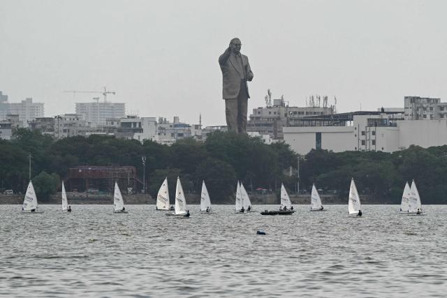 Sailors take part in the International Sailing Championship at Hussain Sagar Lake in Hyderabad on July 15, 2026. (Photo by Noah SEELAM / AFP)