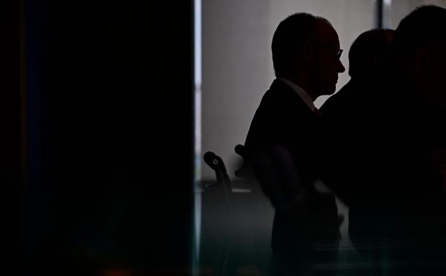 German Chancellor Friedrich Merz (L) addresses journalists during his summer press conference in Berlin, Germany, on July 15, 2026. (Photo by Tobias SCHWARZ / AFP)