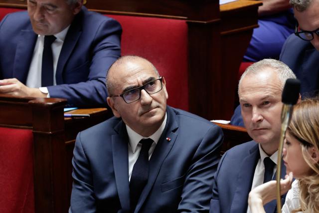 France's Interior Minister Laurent Nunez (C), accompanied by France's junior Minister in charge of Parliament relations Laurent Panifous and France's Government Spokesperson Maud Bregeon attends a session of questions to the government at The National Assembly, France's lower house of parliament in Paris on July 15, 2026. (Photo by STEPHANE DE SAKUTIN / AFP)