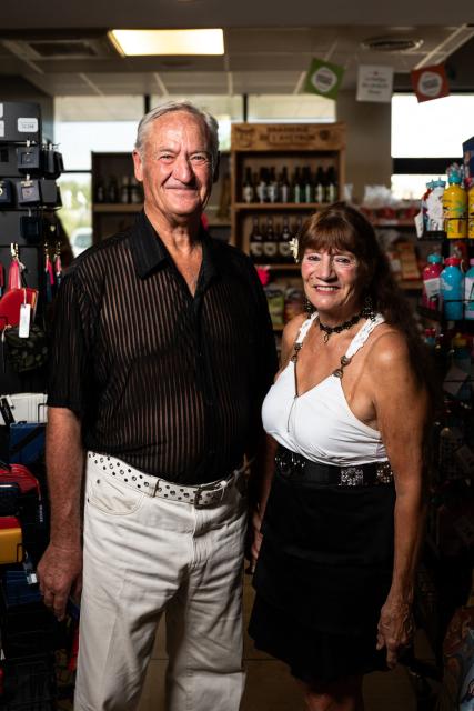 Simon and Chantal, dancers leaving two hours away from the area, pose during a dance session in a bal musette atmosphere at "La Croix de Mille" service area along the Route Nationale 88 (RN88) in Pampelonne, south-western France on July 14, 2026. "La Croix de Mille" service area welcomes travellers passing along the Route Nationale 88 (RN88) and hosts afternoon dance sessions with a bal musette atmosphere. (Photo by Matthieu RONDEL / AFP)