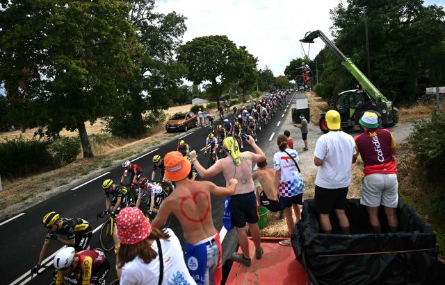 The pack of riders (peloton) cycles during the 11th stage of the 113th edition of the Tour de France cycling race, 161,3 km between Vichy and Nevers in central France, on July 15, 2026. (Photo by Loic VENANCE / AFP)