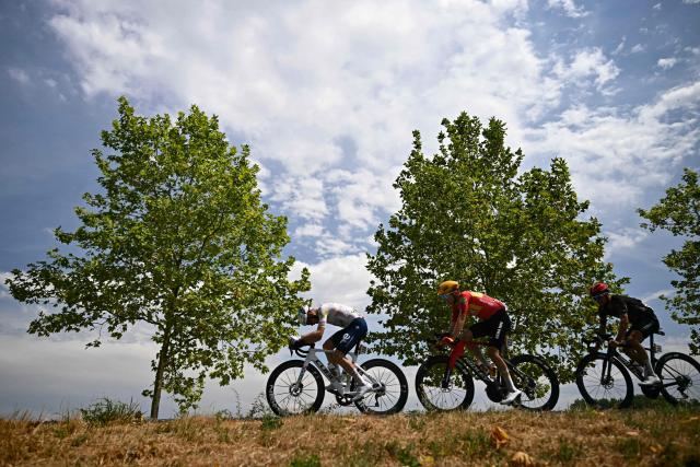 (From L) TotalEnergies team's French rider Mathis Le Berre, Uno-X Mobility team's Danish rider Anthon Charmig and Tudor Pro Cycling Team's French rider Julian Alaphilippe cycle in a breakaway during the 11th stage of the 113th edition of the Tour de France cycling race, 161,3 km between Vichy and Nevers in central France, on July 15, 2026. (Photo by Loic VENANCE / AFP)